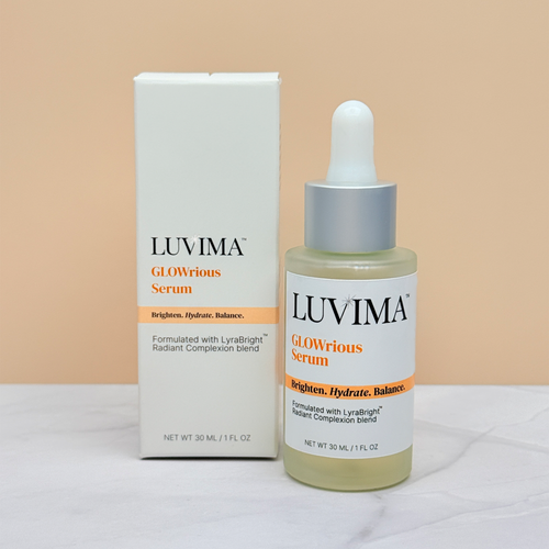 LUVIMA GLOWrious Serum bottle and packaging on a orange background